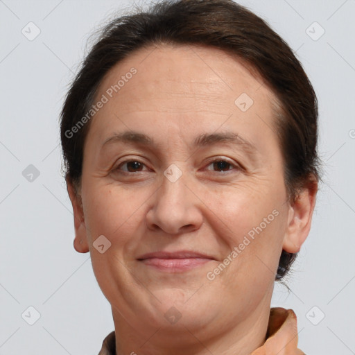 Joyful white adult female with short  brown hair and brown eyes