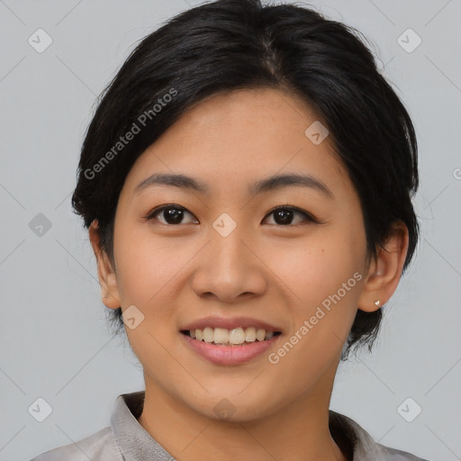 Joyful asian young-adult female with medium  black hair and brown eyes