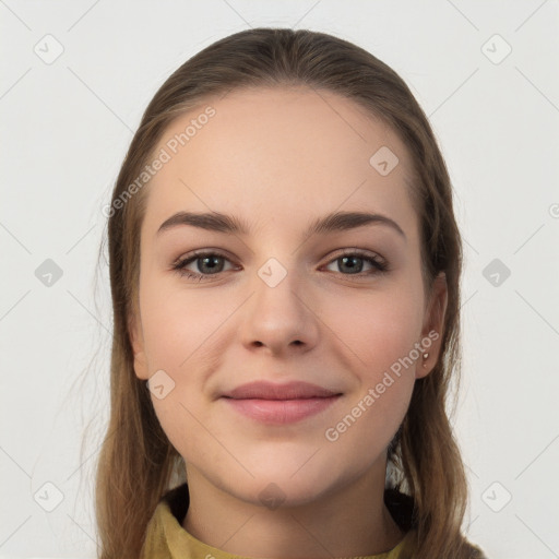 Joyful white young-adult female with long  brown hair and brown eyes