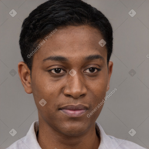 Joyful latino young-adult male with short  brown hair and brown eyes