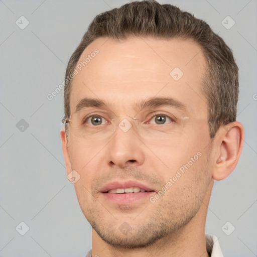 Joyful white adult male with short  brown hair and brown eyes