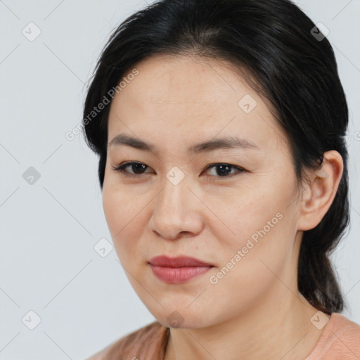 Joyful asian young-adult female with medium  brown hair and brown eyes