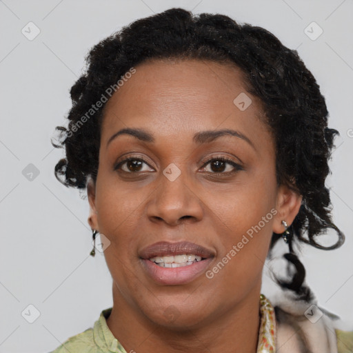 Joyful black adult female with short  brown hair and brown eyes