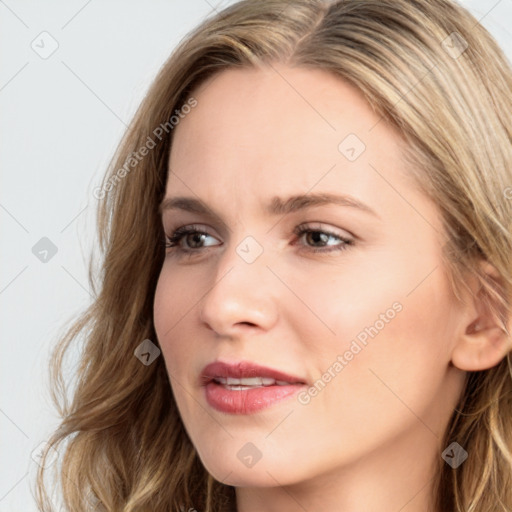 Joyful white young-adult female with long  brown hair and blue eyes