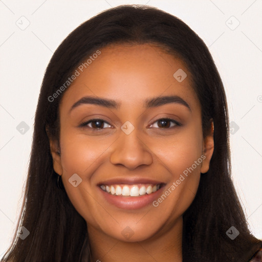 Joyful latino young-adult female with long  brown hair and brown eyes