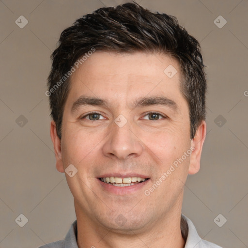 Joyful white adult male with short  brown hair and brown eyes