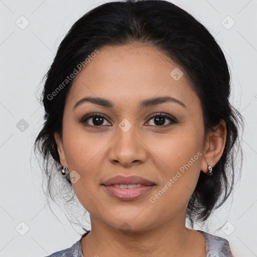 Joyful latino young-adult female with medium  brown hair and brown eyes