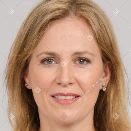 Joyful white adult female with long  brown hair and brown eyes