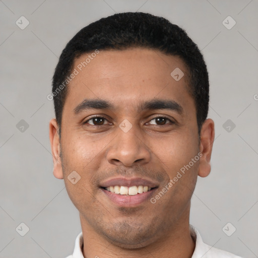 Joyful latino young-adult male with short  brown hair and brown eyes