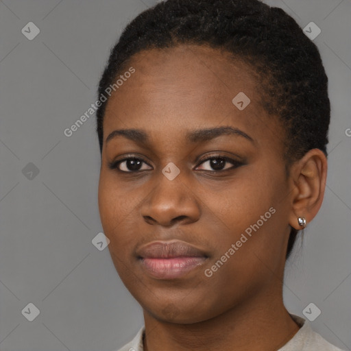 Joyful black young-adult female with short  black hair and brown eyes