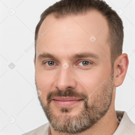 Joyful white adult male with short  brown hair and brown eyes