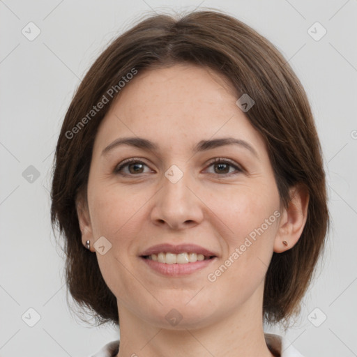 Joyful white adult female with medium  brown hair and grey eyes