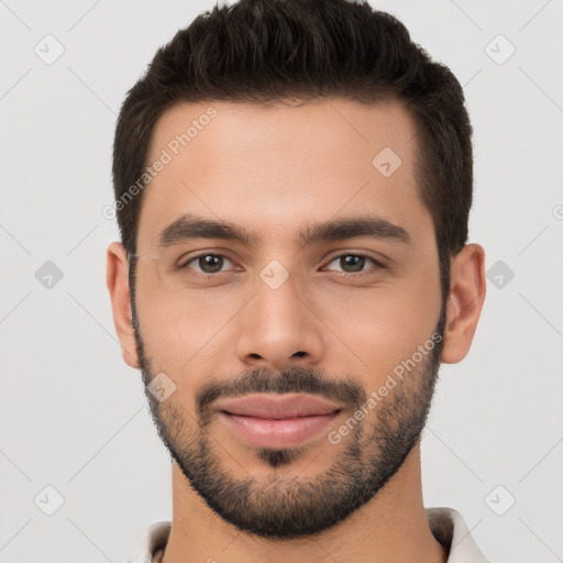 Joyful white young-adult male with short  brown hair and brown eyes