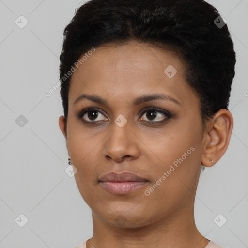 Joyful black young-adult female with short  brown hair and brown eyes