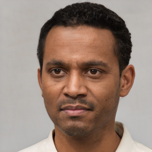 Neutral latino adult male with short  black hair and brown eyes