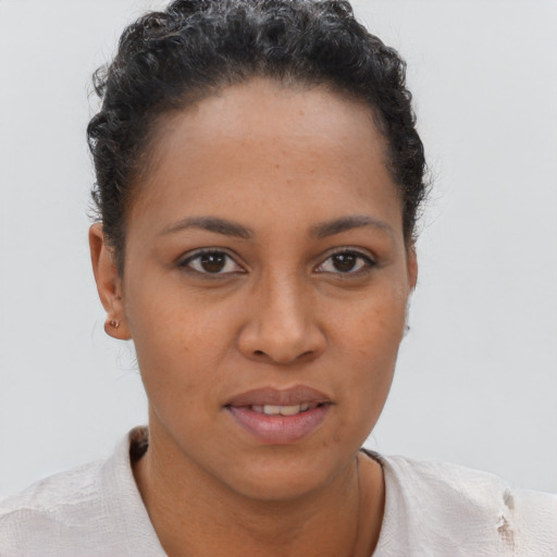 Joyful black young-adult female with short  brown hair and brown eyes