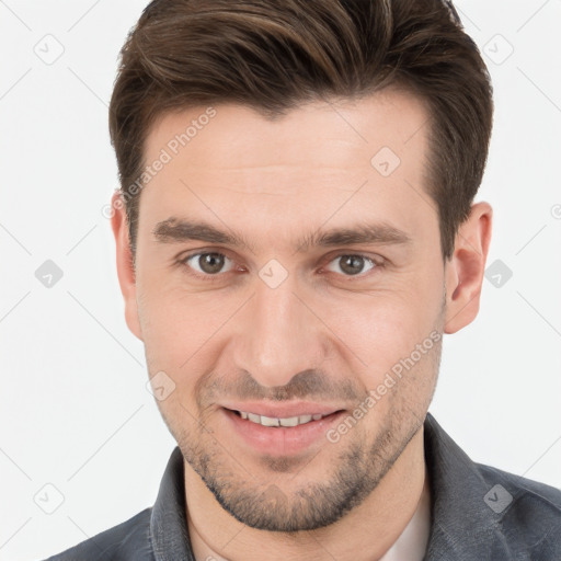 Joyful white young-adult male with short  brown hair and brown eyes