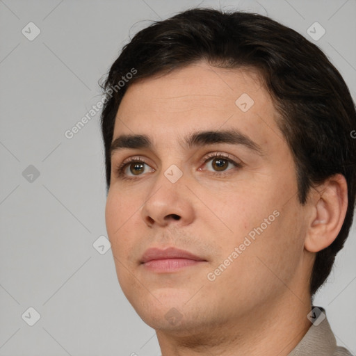 Neutral white young-adult male with short  brown hair and brown eyes