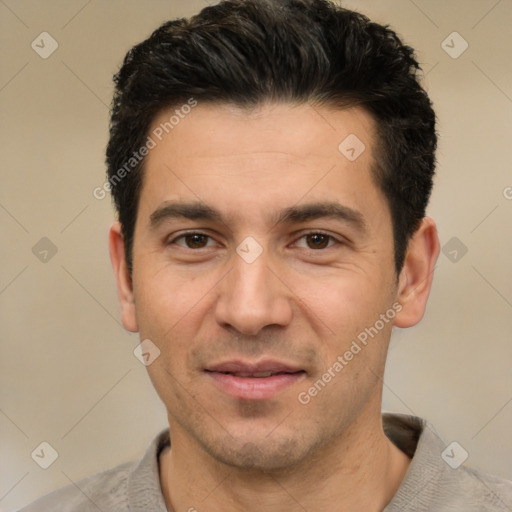 Joyful white adult male with short  black hair and brown eyes