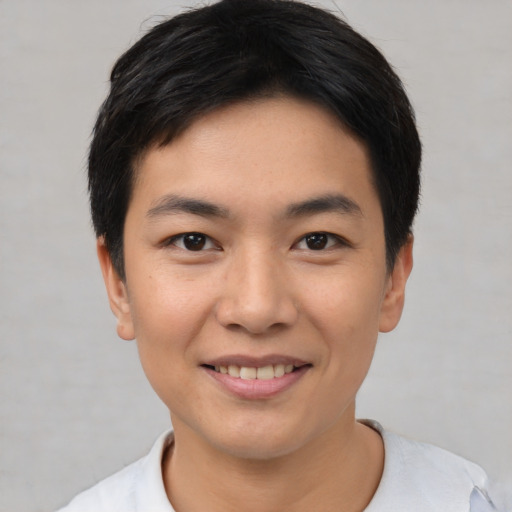 Joyful white young-adult male with short  black hair and brown eyes