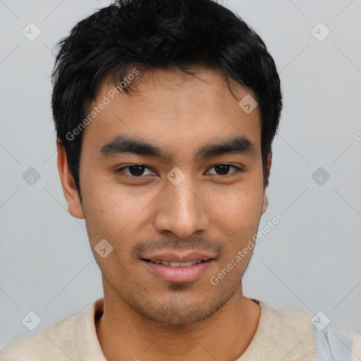 Joyful asian young-adult male with short  black hair and brown eyes