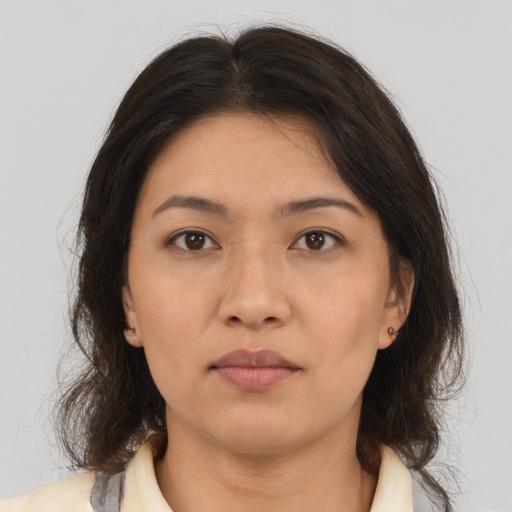 Neutral latino young-adult female with medium  brown hair and brown eyes
