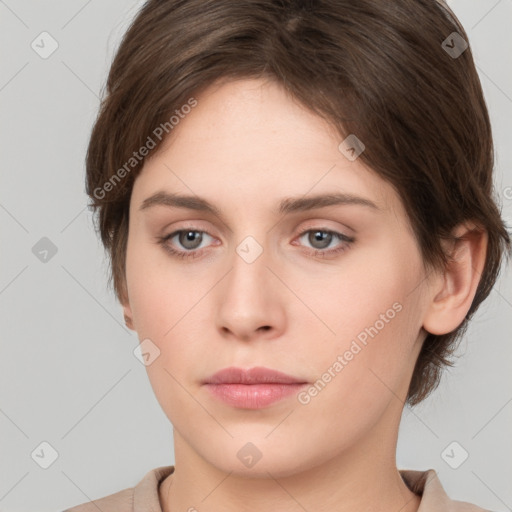 Neutral white young-adult female with short  brown hair and brown eyes