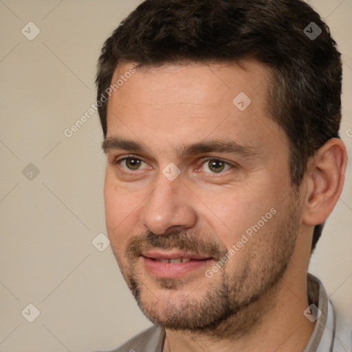 Joyful white adult male with short  brown hair and brown eyes