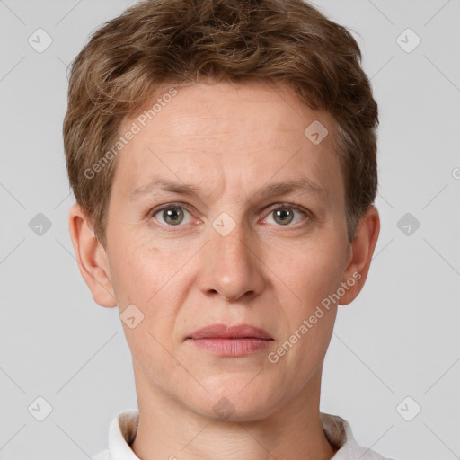 Joyful white adult male with short  brown hair and grey eyes