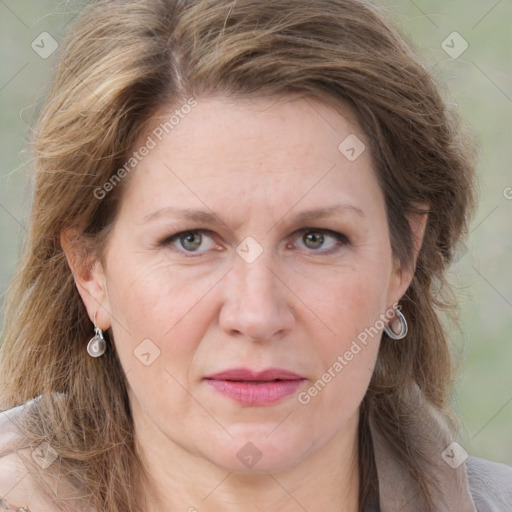 Joyful white adult female with medium  brown hair and grey eyes