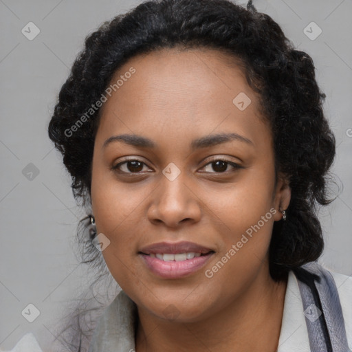 Joyful black young-adult female with long  brown hair and brown eyes