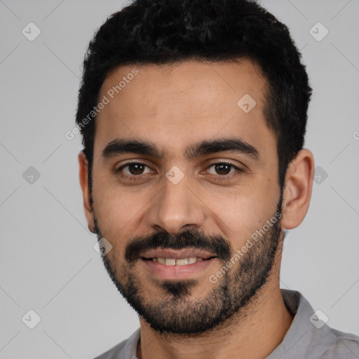 Joyful latino young-adult male with short  black hair and brown eyes