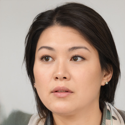 Neutral asian young-adult female with medium  brown hair and brown eyes