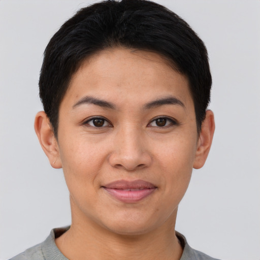 Joyful asian young-adult female with short  brown hair and brown eyes