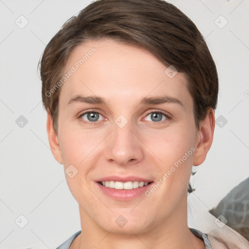 Joyful white young-adult female with short  brown hair and grey eyes