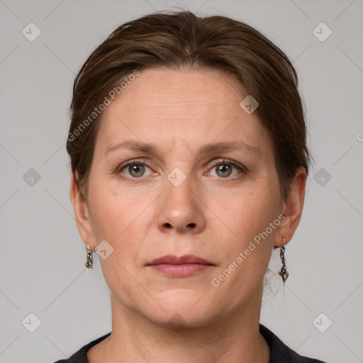 Joyful white adult female with short  brown hair and grey eyes