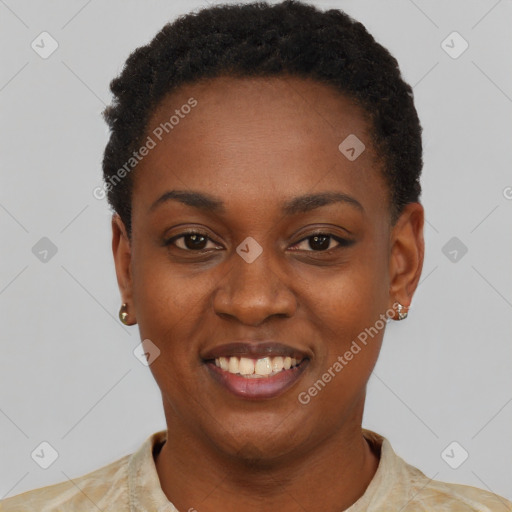 Joyful black young-adult female with short  black hair and brown eyes