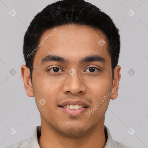 Joyful latino young-adult male with short  black hair and brown eyes