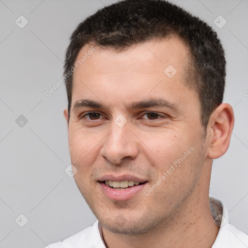 Joyful white young-adult male with short  brown hair and brown eyes