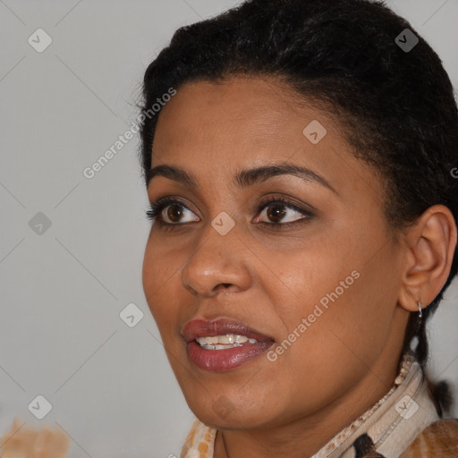 Joyful black young-adult female with long  brown hair and brown eyes