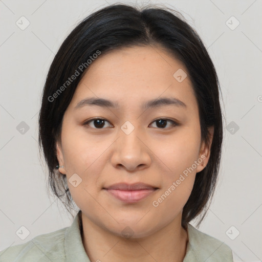 Joyful latino young-adult female with medium  brown hair and brown eyes