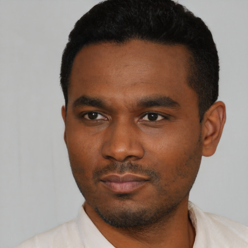 Neutral black young-adult male with short  black hair and brown eyes