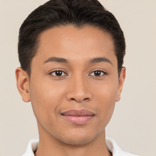 Joyful latino young-adult male with short  brown hair and brown eyes