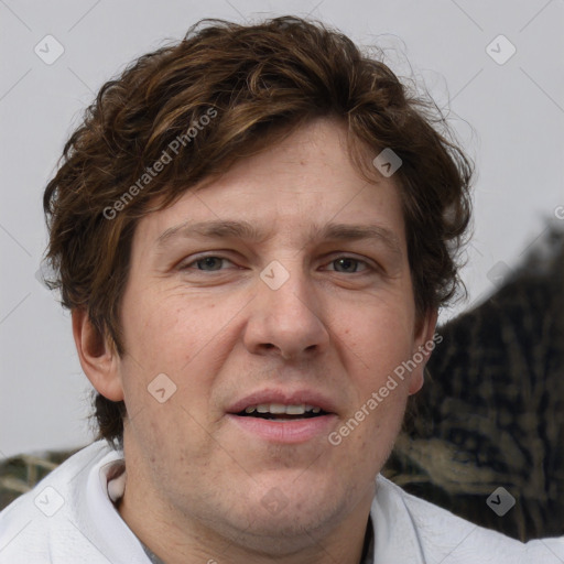 Joyful white adult male with short  brown hair and grey eyes