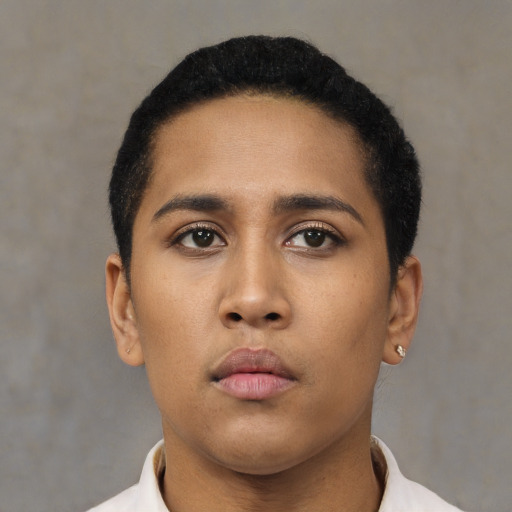 Neutral latino young-adult female with short  black hair and brown eyes