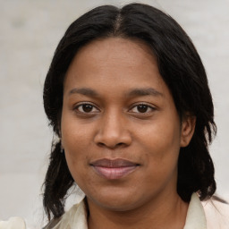 Joyful black young-adult female with medium  brown hair and brown eyes