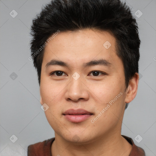 Joyful asian young-adult male with short  black hair and brown eyes