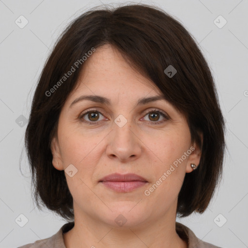 Joyful white adult female with medium  brown hair and brown eyes