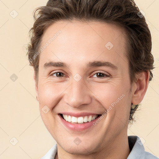 Joyful white young-adult male with medium  brown hair and brown eyes