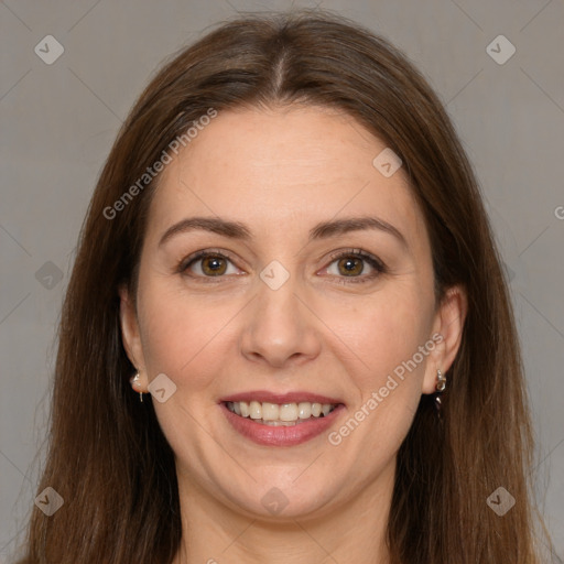 Joyful white adult female with long  brown hair and grey eyes